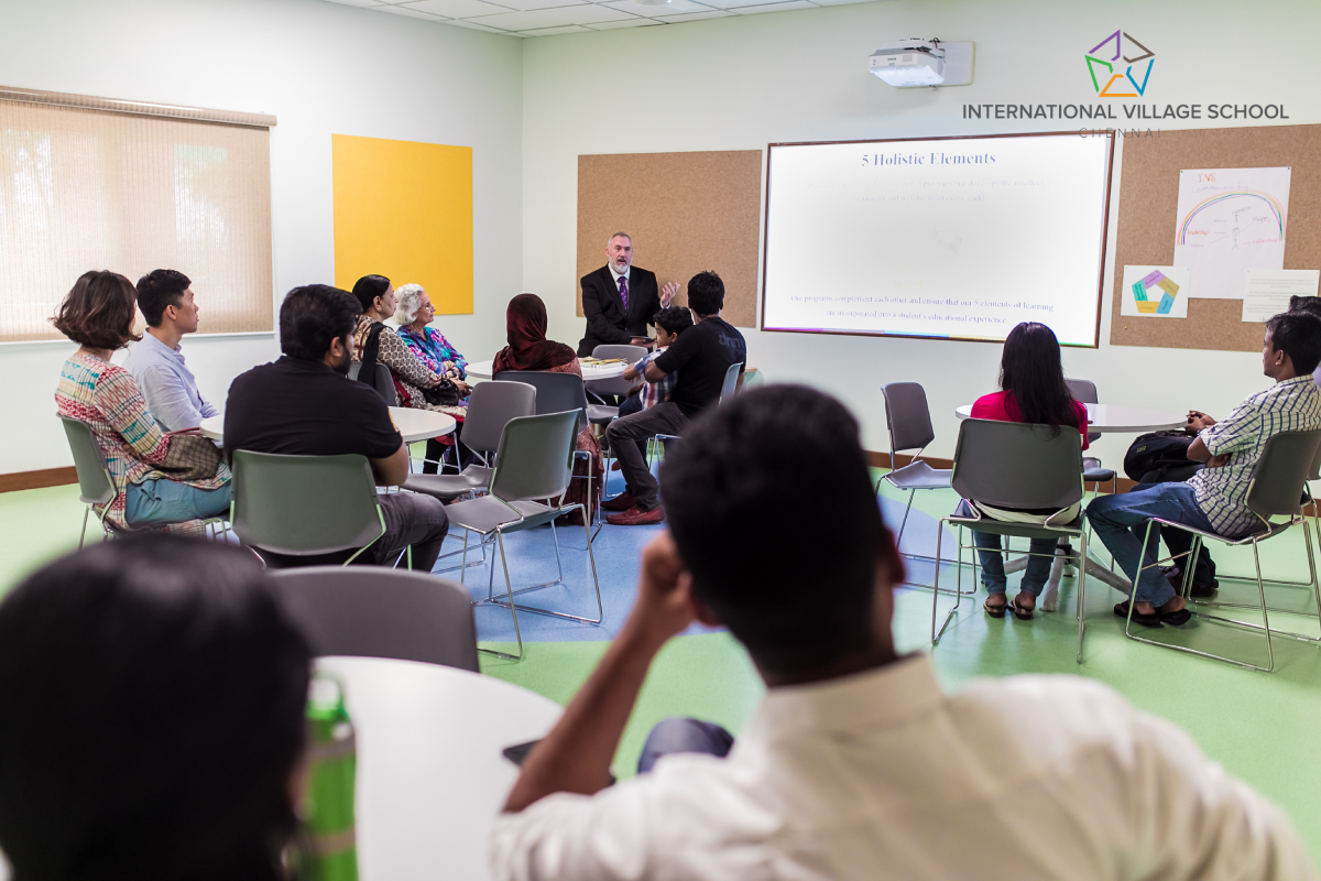 Mr. Peter Bird, Superintendent of The International Village School, addressing the teachers of the school.